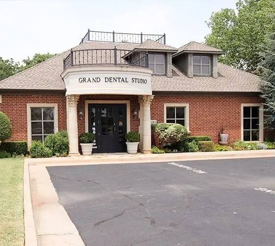 Grand Dental Studio's brick building and white portico on NW Grand Boulevard, Oklahoma City.